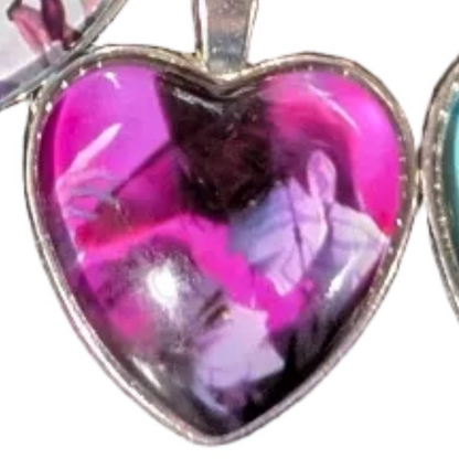 K-POP Demon Hunters heart pendant necklace featuring character art from Ralphie's Funhouse, with Jinu and Rumi design.