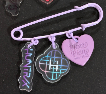 K-POP DEMON HUNTERS safety pin charm featuring characters from Ralphie's Funhouse, detailed design on metal safety pin.