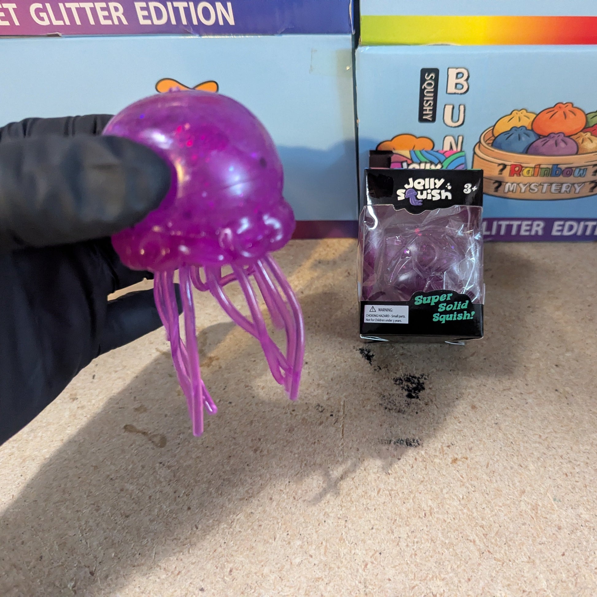 Purple Wannabe Jellysquish jellyfish water squish toy from Ralphie's Funhouse with a soft, squishy texture and tentacle details.