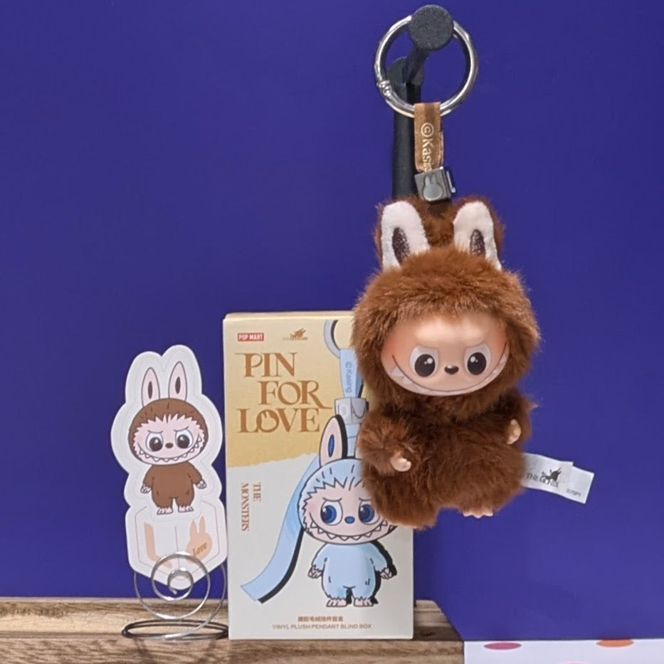 Sealed blind box featuring Ralphie's Funhouse Labubu pin with customizable letter options for love-themed collectible.