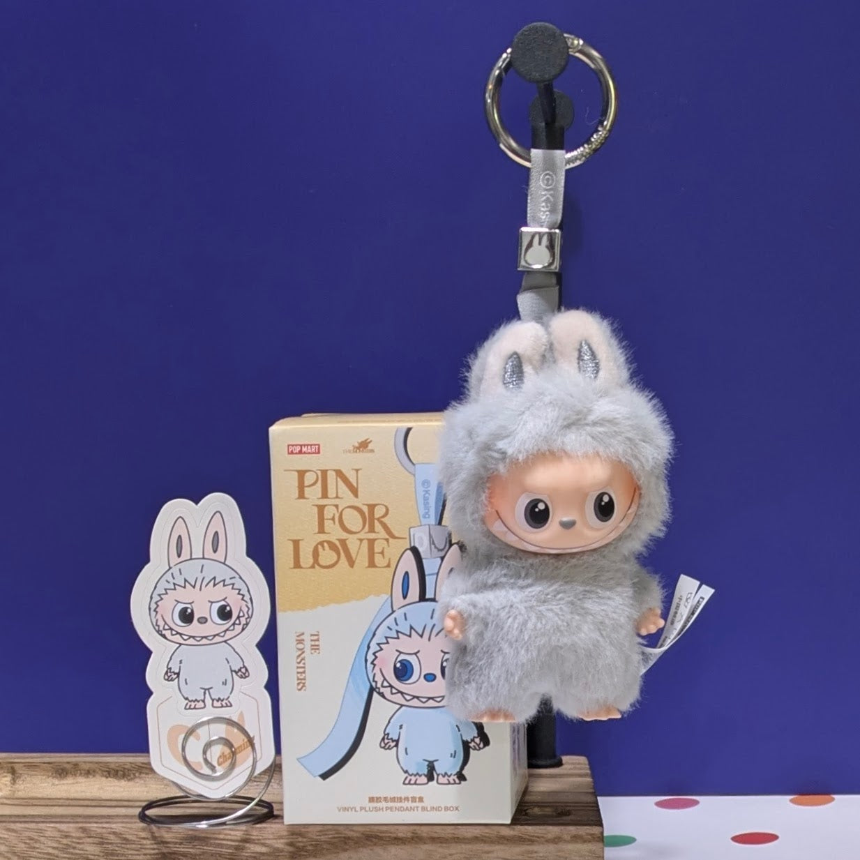 Sealed blind box featuring Ralphie's Funhouse Labubu Pin for Love, with colorful character design and letter options inside.