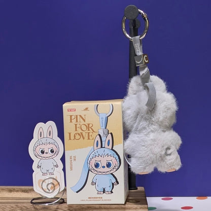 Sealed blind box from Ralphie's Funhouse featuring Popmart Labubu Pin for Love, with customizable letter options.