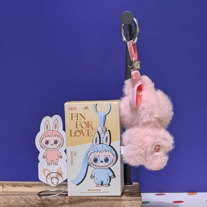 Sealed blind box featuring Ralphie's Funhouse Labubu pin for love with customizable letter options, in stock and ready to open.