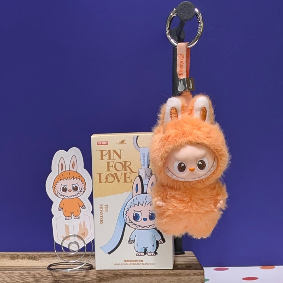 Sealed blind box featuring Ralphie's Funhouse Labubu Pin for Love, with colorful letter design, in stock for collector's display.