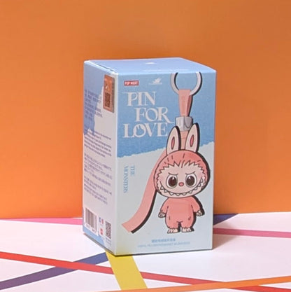 Sealed blind box featuring Ralphie's Funhouse Labubu pin for love with customizable letter options, in stock and ready to open.
