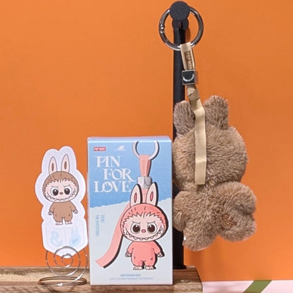 Sealed blind box featuring Ralphie's Funhouse Labubu pin with letter options, collectible pin for love from Popmart.