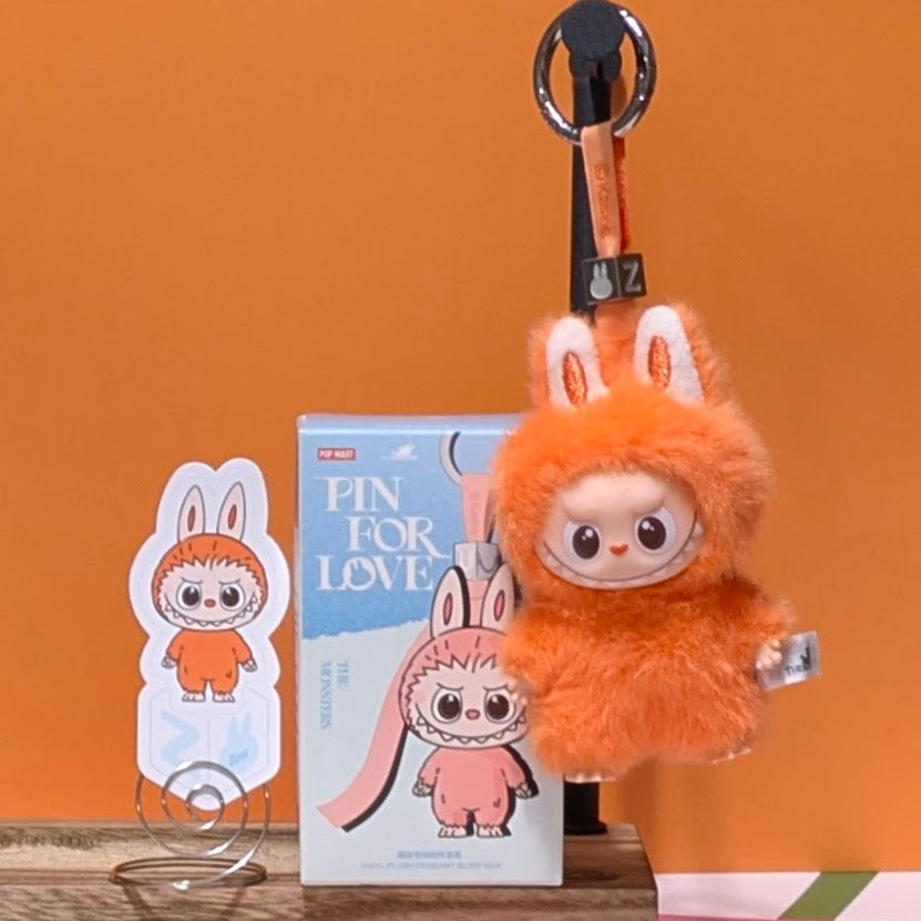 Sealed blind box featuring Ralphie's Funhouse Labubu Pin for Love with customizable letter options, in stock and ready to open.