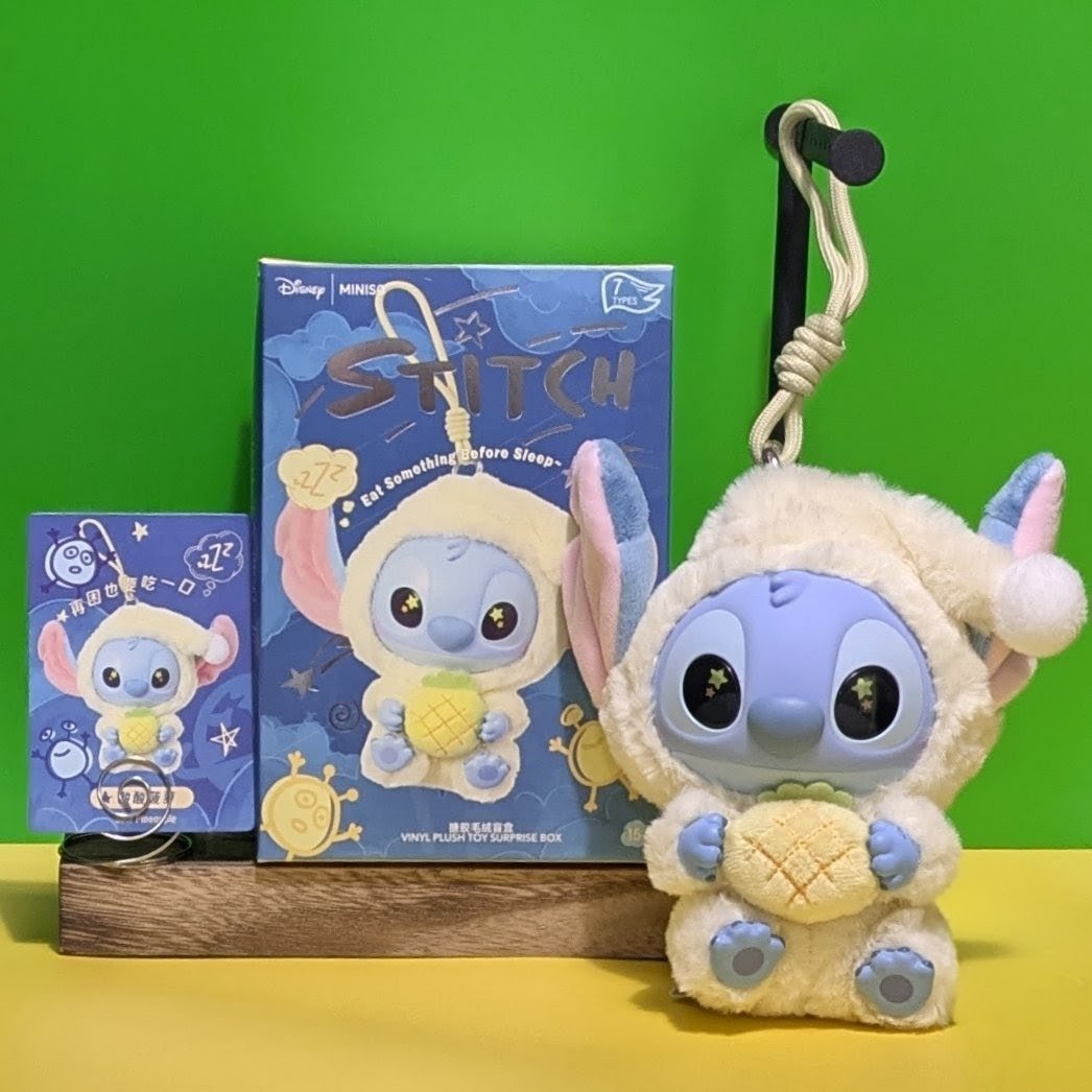 Sealed blind box featuring Ralphie's Funhouse Stitch plush keychain from Miniso, showing Stitch eating before sleep design.