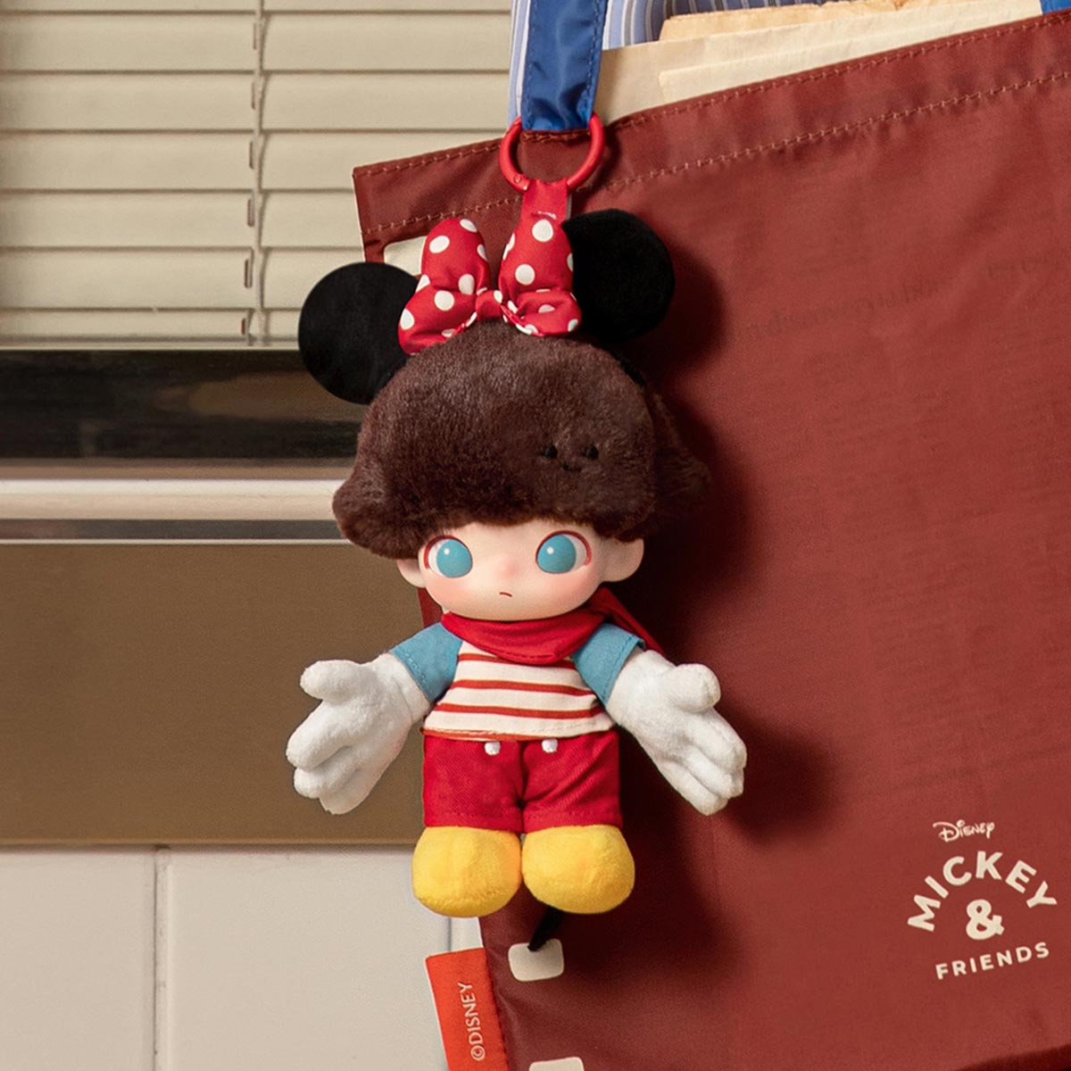 Disney-themed DIMOO World vinyl plush keychain from Popmart, sealed blind box with colorful character design.