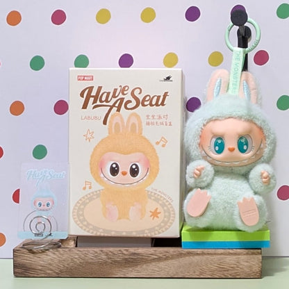Sealed Popmart Have a Seat Labubu vinyl plush blind box from Ralphie's Funhouse, featuring colorful plush character in a sealed box.