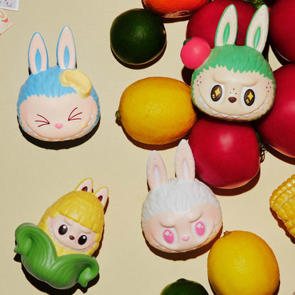 Sealed POPMART Wacky Mart Series Pinch Pendant Squishy Charm Blind Box with colorful character design in original packaging.