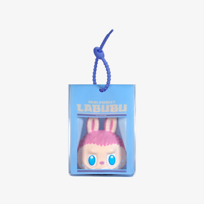 Sealed POPMART Wacky Mart Series Pinch Pendant Squishy Charm blind box from Ralphie's Funhouse, featuring colorful toy design.