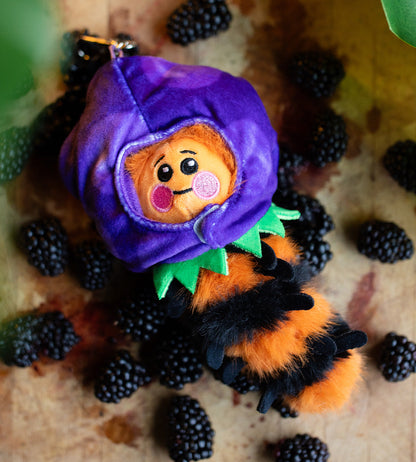 Sealed blind box featuring Kaleidos Creative Wooly Bear and Friends plush keychain by Ralphie's Funhouse, colorful and soft fabric.