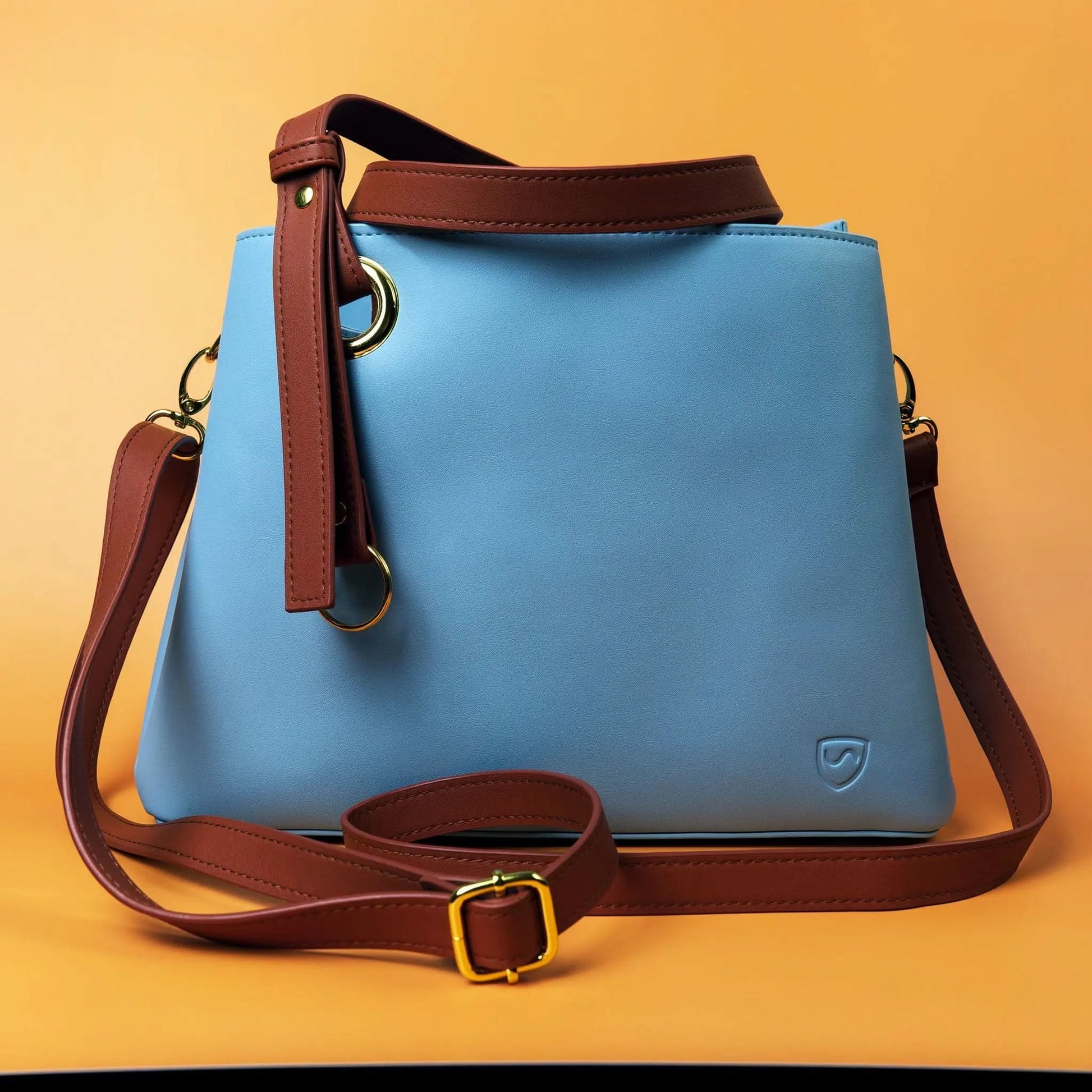 Shield Your Body SYB purse for mobile phones, compact accessory with a sleek design, ideal for carrying phone essentials.