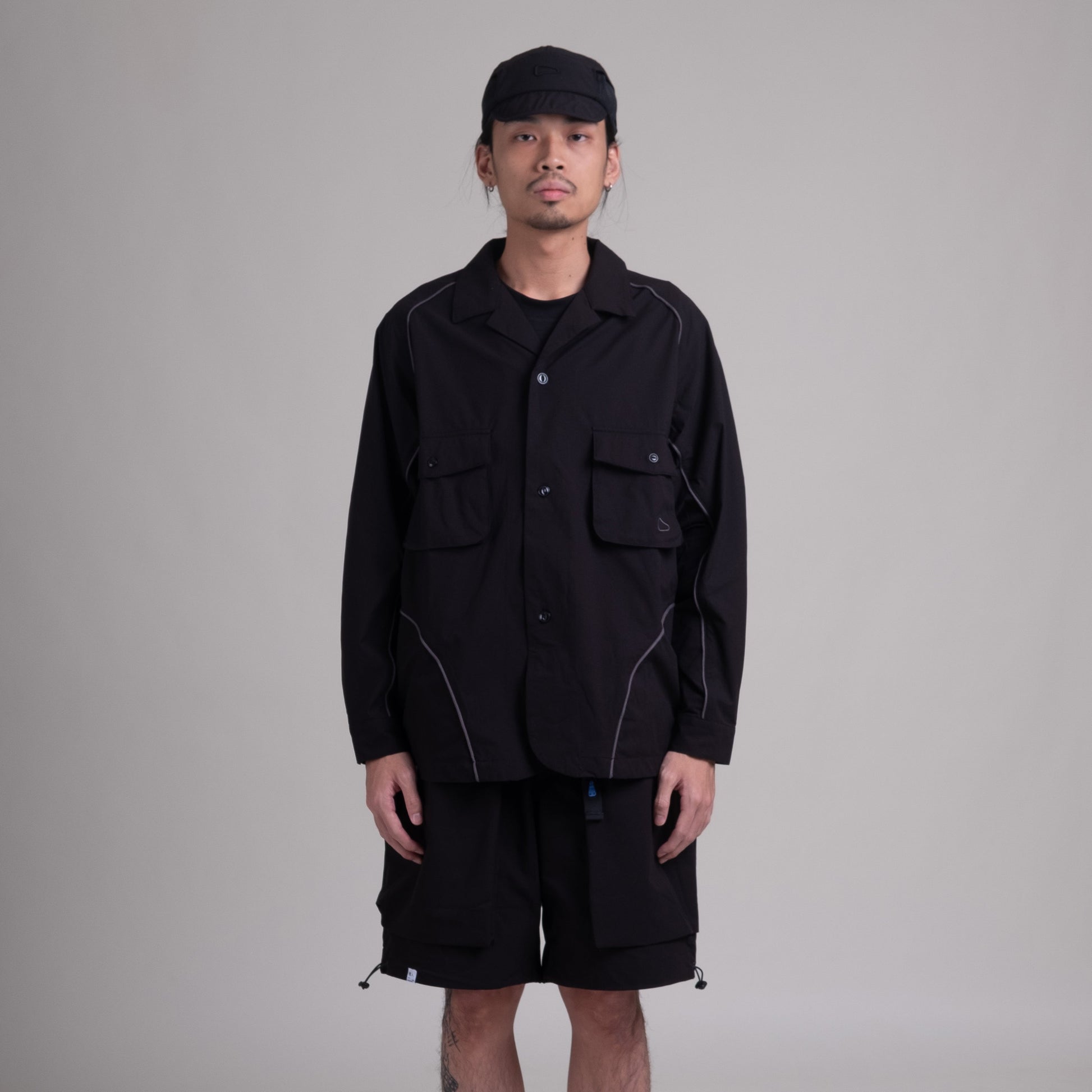 Shuren Projects OTJacket in black with Teflon™ coating, stylish outdoor jacket with durable water-resistant fabric.
