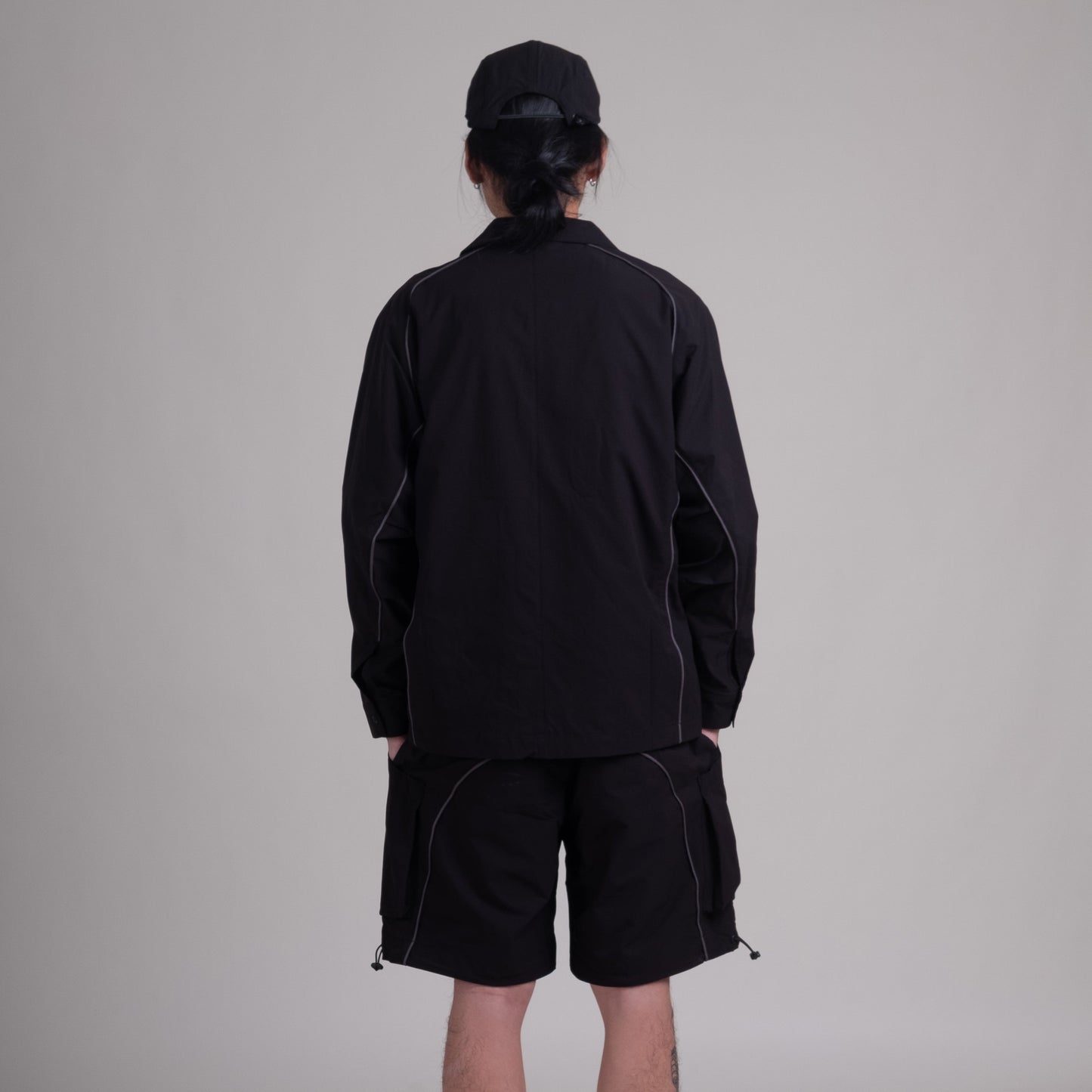 Black OTJacket by Shuren Projects with Teflon™ coating, showcasing a sleek, durable jacket with a modern fit.