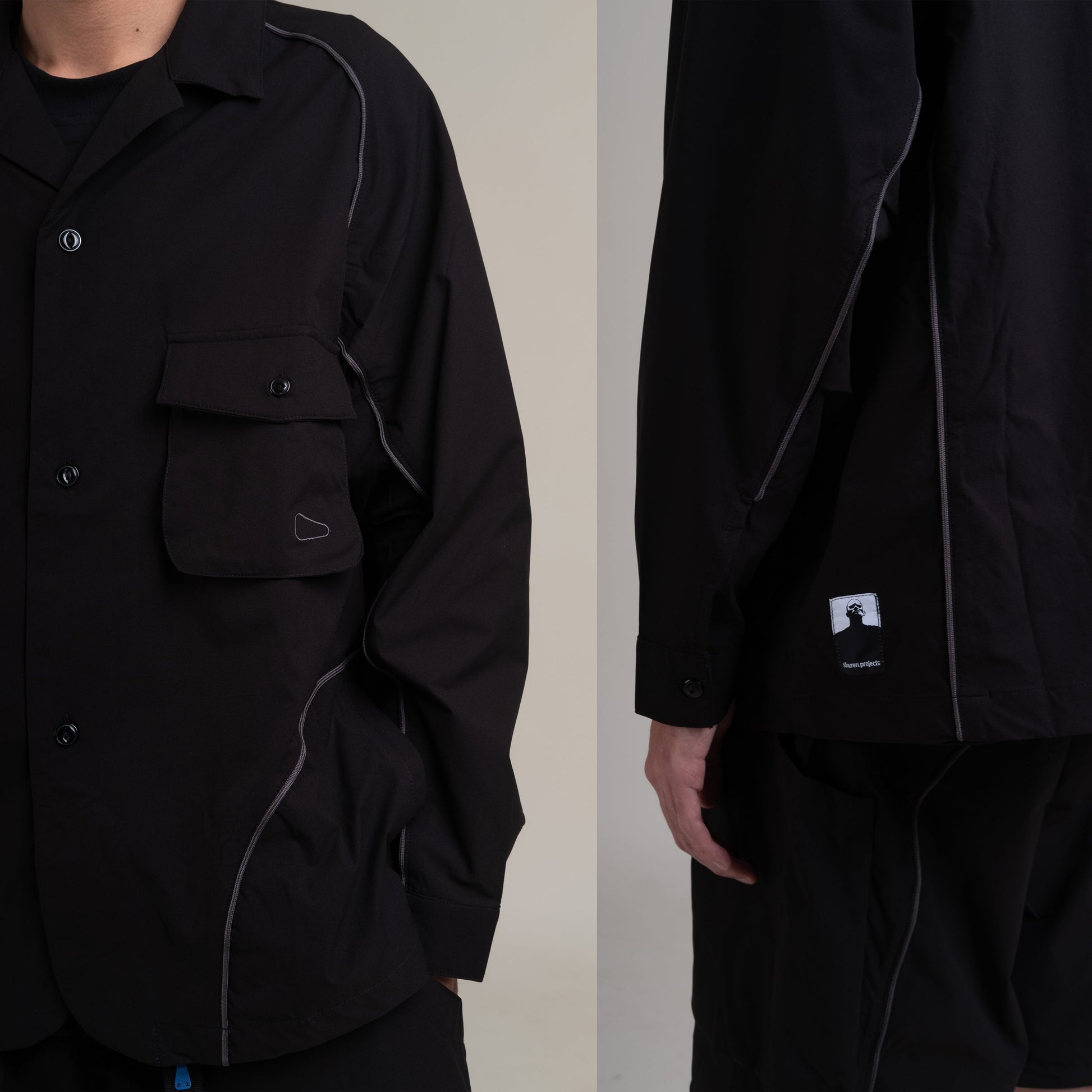 Black OTJacket by Shuren Projects with Teflon™ coating, shown in a close-up image highlighting the fabric and design details.