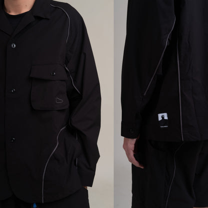 Black OTJacket by Shuren Projects with Teflon™ coating, shown in a close-up image highlighting the fabric and design details.