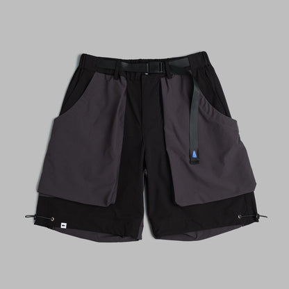 Black Shuren Projects camping shorts made of 2-tone nylon, shown laid flat with pockets and adjustable waistband.
