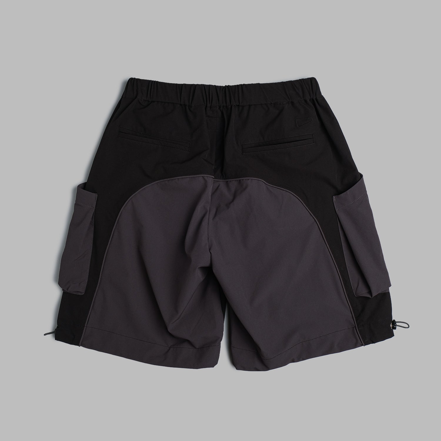 Black 2-tone nylon camping shorts by Shuren Projects, featuring a lightweight, durable design for outdoor adventures.