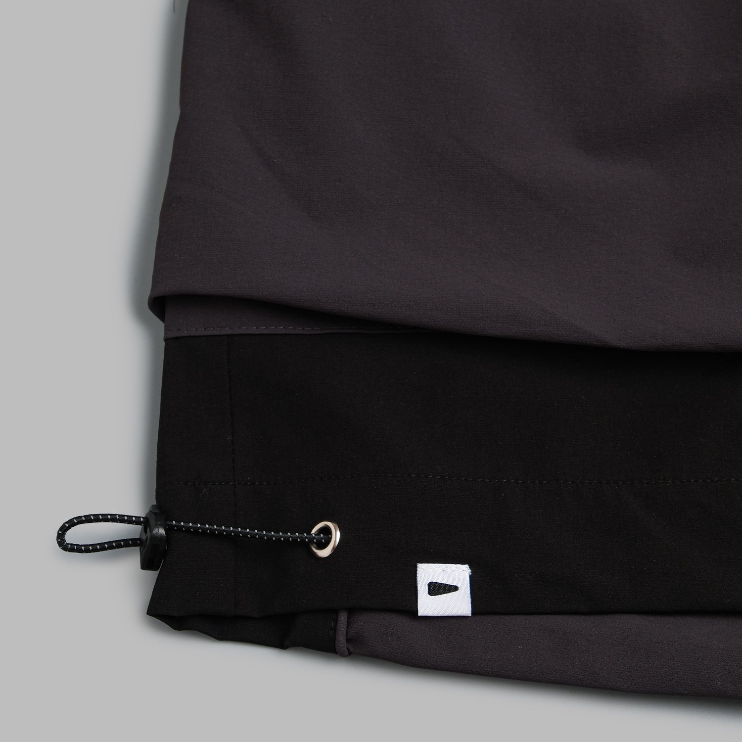 Black 2-tone nylon camping shorts by Shuren Projects, lightweight and durable for outdoor adventures.