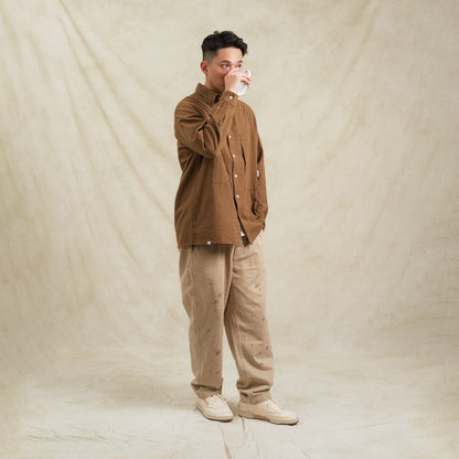 Brown checkered Seersucker cotton sidepull shirt by Shuren Projects, featuring a casual, stylish design and classic pattern.