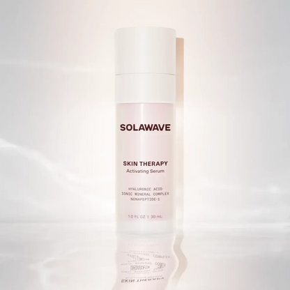 Solawave Skin Therapy Activating Serum in a 30ml bottle, a skincare topical with a clear liquid formula and pump dispenser.