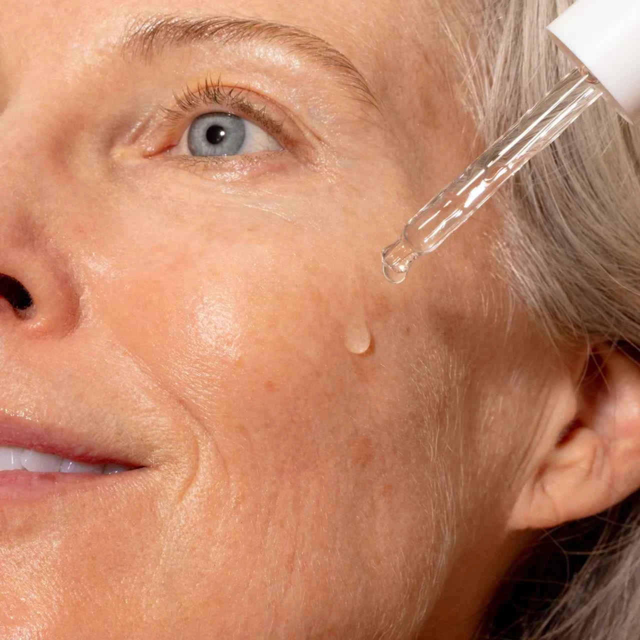 Solawave Pre- & Probiotic Plumping Peptide Serum in a clear bottle with a pump dispenser, suitable for skincare routines.