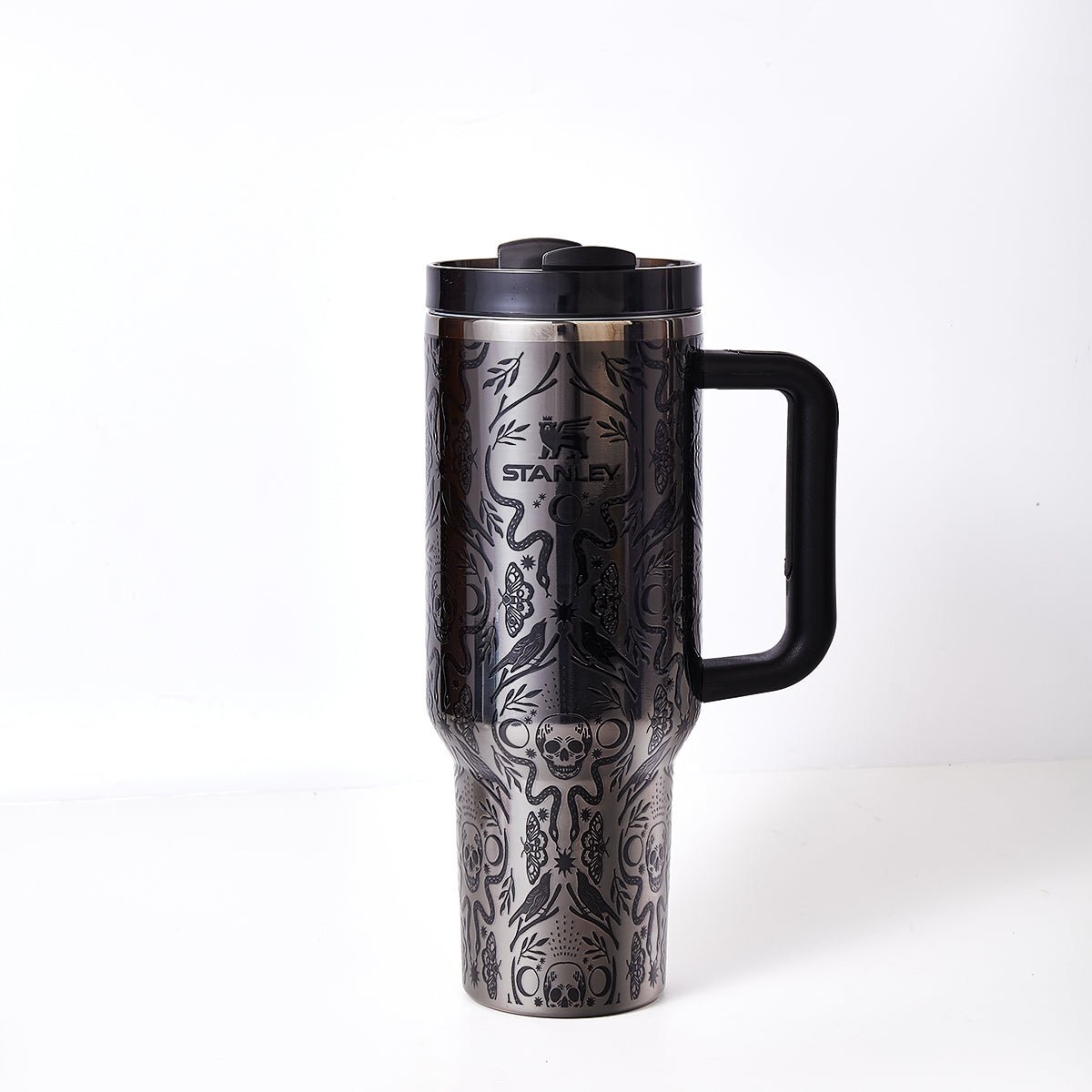 STANLEY Halloween Quencher H2.0 FlowState tumbler with Deadly Damask design, stainless steel, leak-proof lid, and insulated body.