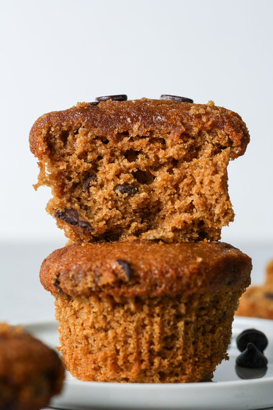 Sweet Addison's protein muffin with a golden-brown top and moist interior, showcasing a healthy, high-protein snack.