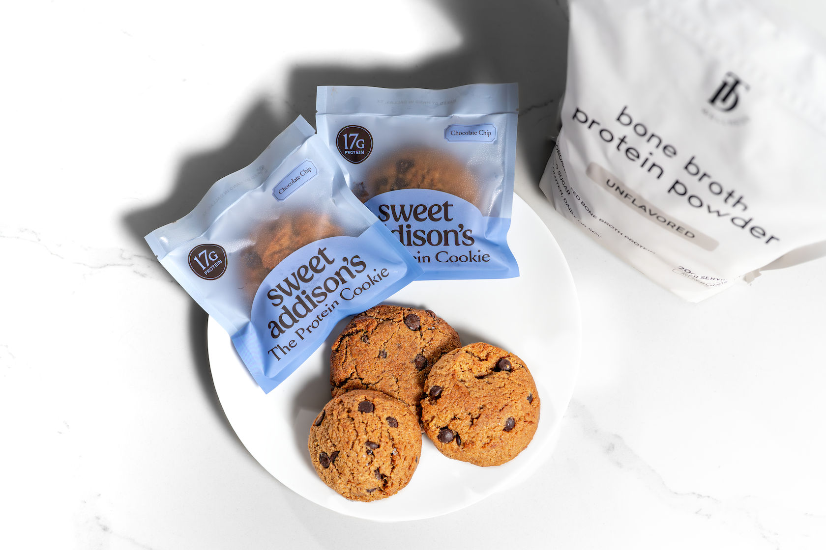 Four Sweet Addison's Protein Cookies with 17g protein each, featuring a golden-brown baked appearance and soft texture.