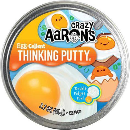 Sweet Palace Crazy Aaron's Thinking Putty in Better Butter color, showing shiny, malleable putty on a white surface.