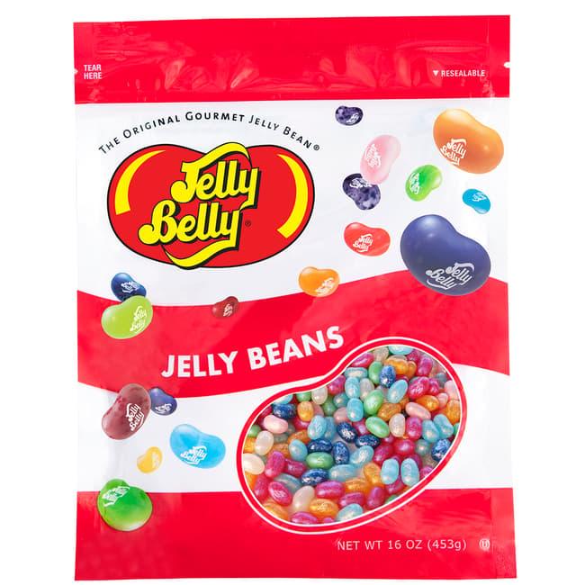 Assorted Jelly Belly Jewel Collection candies in vibrant, jewel-like colors from Sweet Palace, displayed in a clear container.