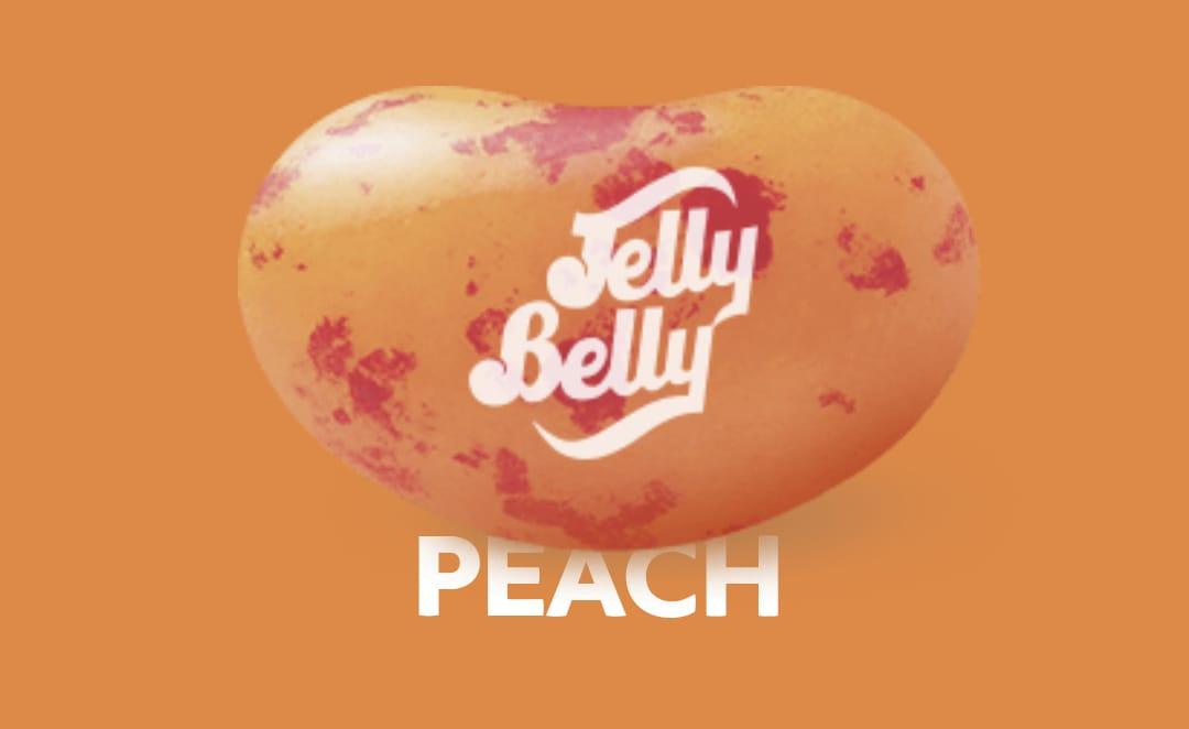 Assorted Peach-flavored Jelly Belly candies in a clear bag from Sweet Palace, showcasing bright orange and peach-colored sweets.