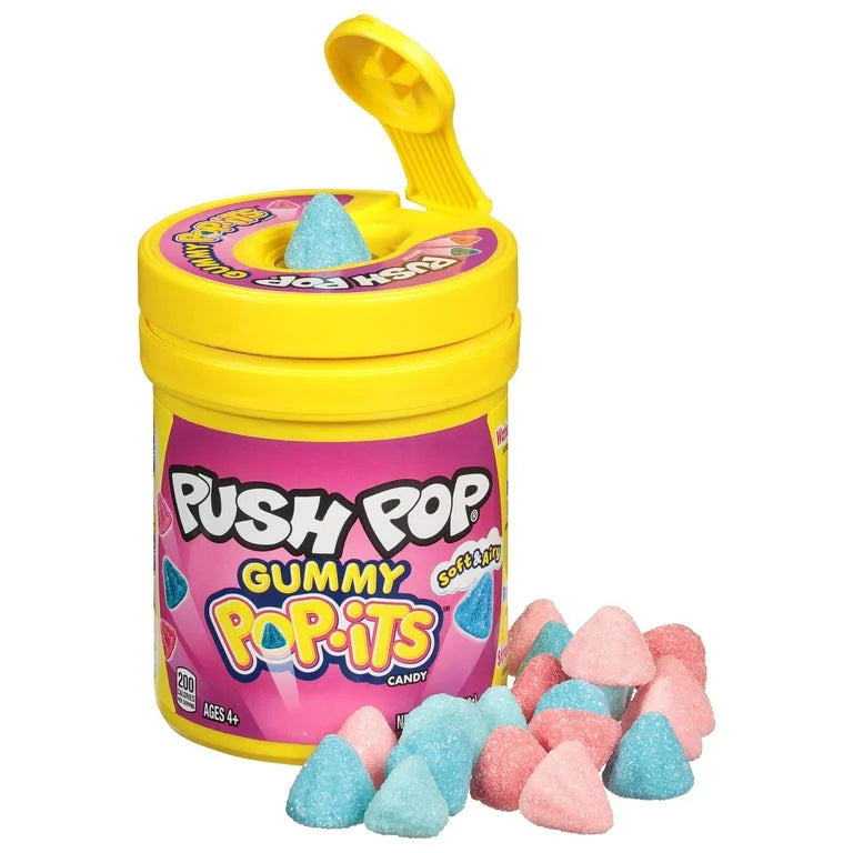 Sweet Palace Push Pop candy in a colorful plastic container with a twist-open lid, filled with layered fruity-flavored candy.