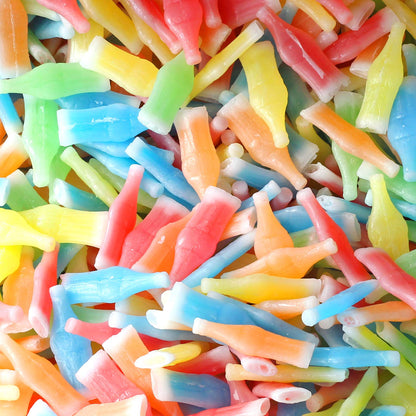 Colorful wax candy bottles from Sweet Palace, shaped like miniature candy bottles in various bright colors.