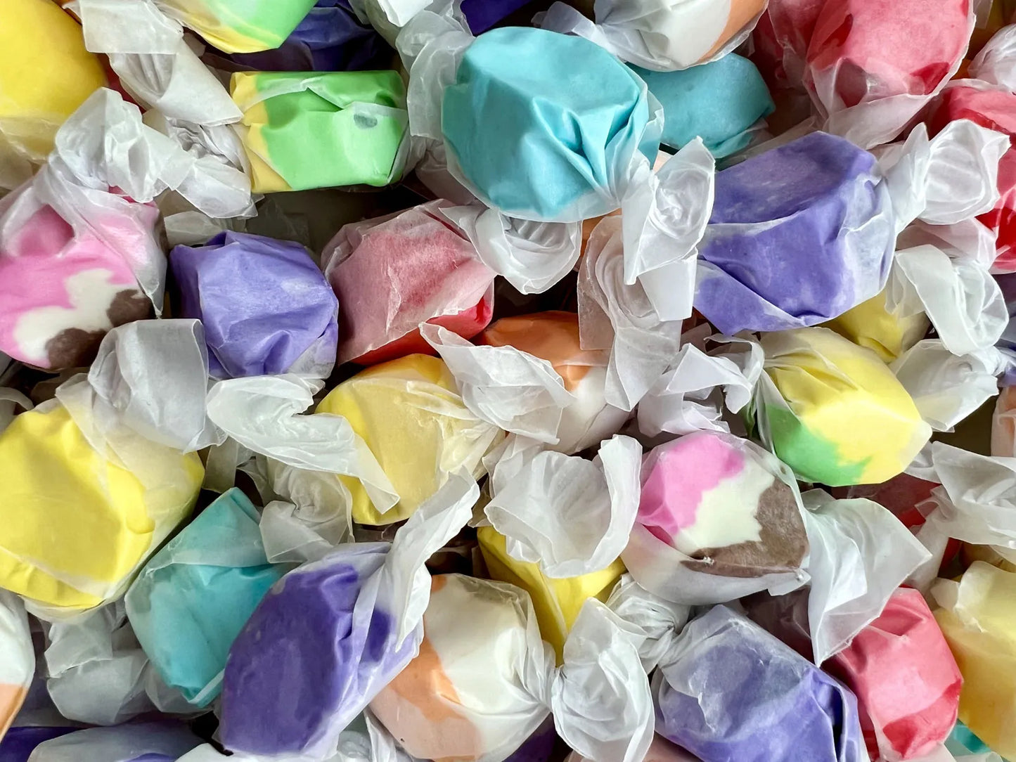 Blue raspberry salt water taffy from Sweet Palace, soft chewy candy in a vibrant blue color.