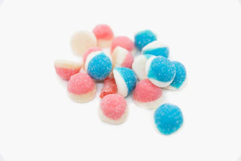 Blue Raz Puffs candy by Sweet Palace in a colorful bag, showcasing the vibrant, round, blue and purple candies.