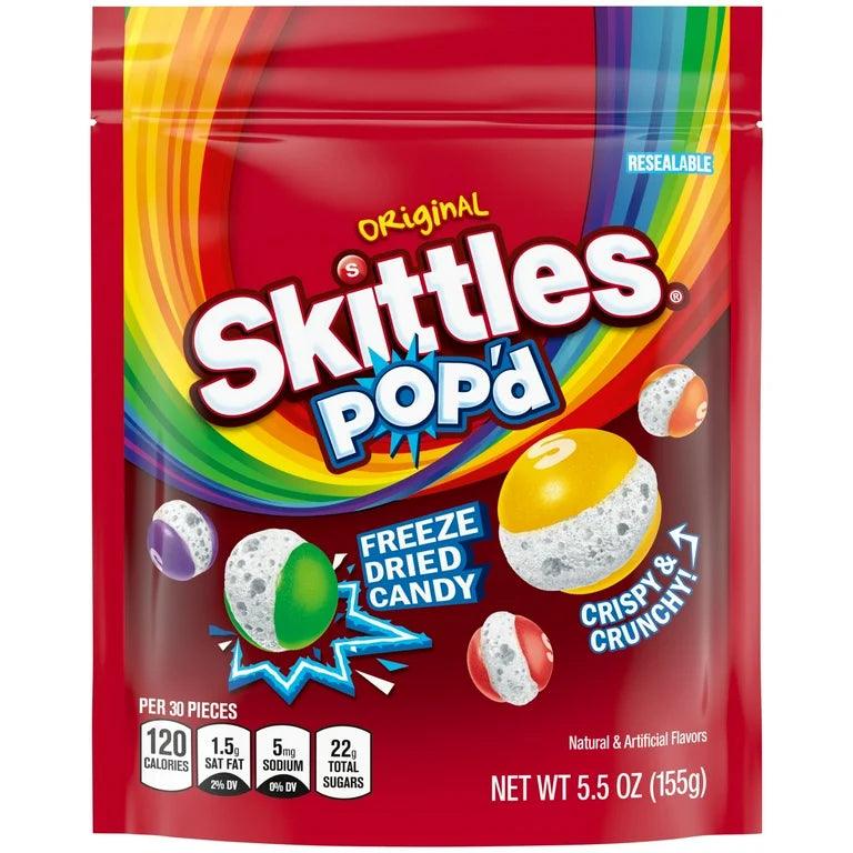 Colorful Skittles Pop'd Original freeze-dried candy by Sweet Palace, showing vibrant, crispy candy pieces in a clear container.