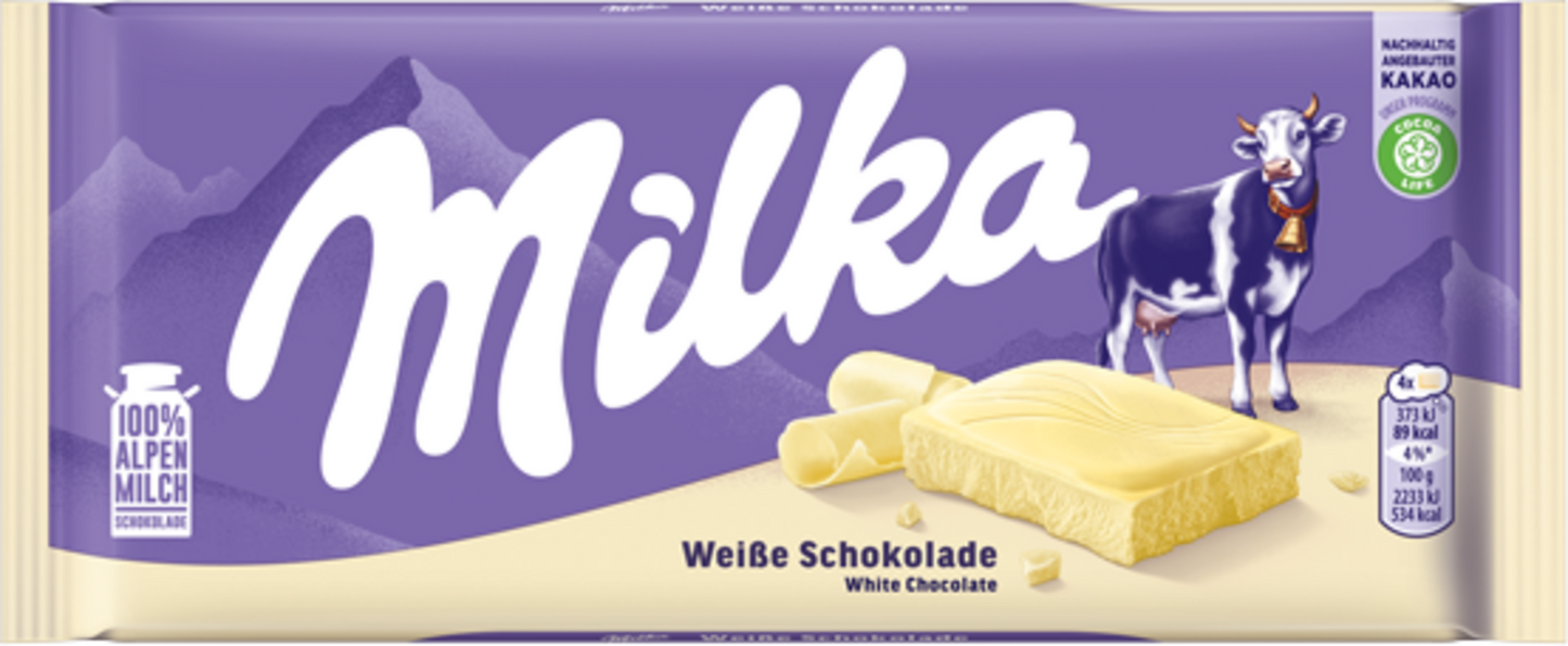 Sweet Palace Milka chocolates in alpine milk flavor, showing a pile of creamy, milk chocolate candies with purple packaging.