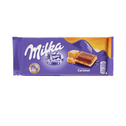 Assorted Milka Chocolates by Sweet Palace, featuring creamy alpine milk candies in colorful packaging.