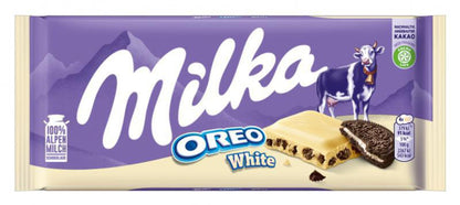 Milka chocolates, Alpine milk flavor, Sweet Palace candy in colorful packaging, showcasing creamy milk chocolate pieces.