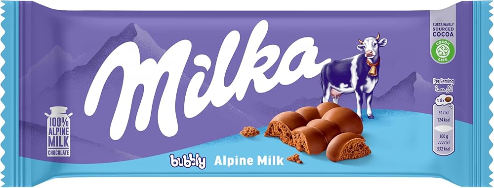 Sweet Palace Milka Alpine Milk chocolates in colorful packaging, showcasing creamy milk chocolate candies.