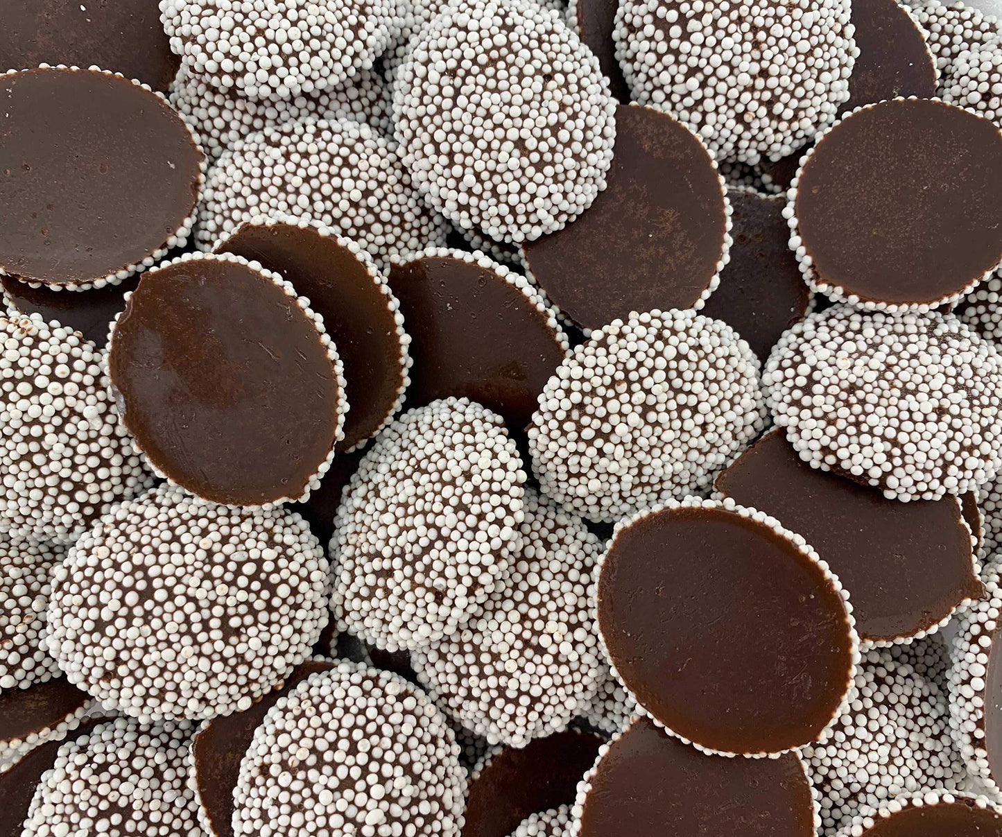 Sweet Palace candy nonpareils in a 1-2 lb bag, colorful round sugar-coated chocolate sprinkles for baking and decorating desserts.