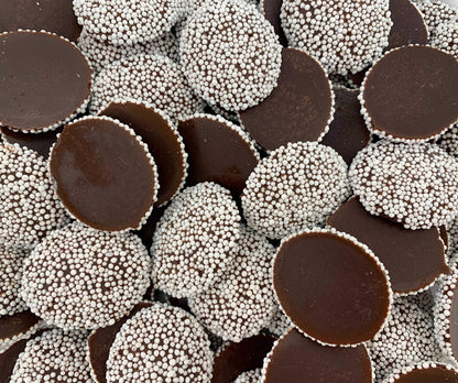 Sweet Palace candy nonpareils in a 1-2 lb bag, colorful round sugar-coated chocolate sprinkles for baking and decorating desserts.