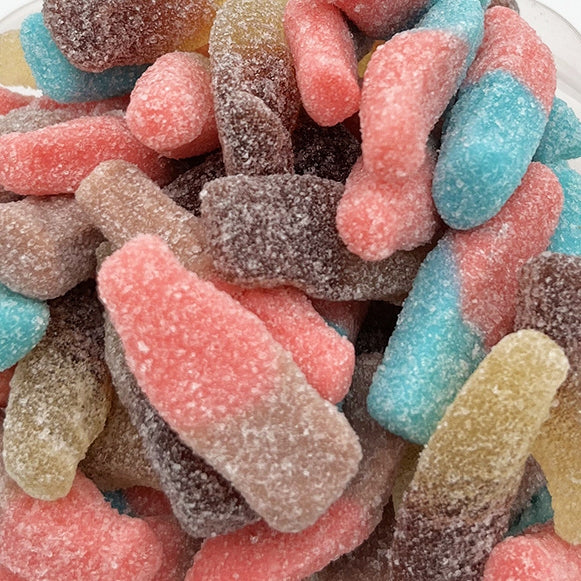Colorful Sour Gummy Bottles candy from Sweet Palace with blue razz flavor, featuring bright, sour-coated gummy bottles.