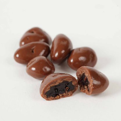 Sweet Palace chocolate-covered nuts with peanuts, coated in smooth milk chocolate, in a 1-2 lb package.