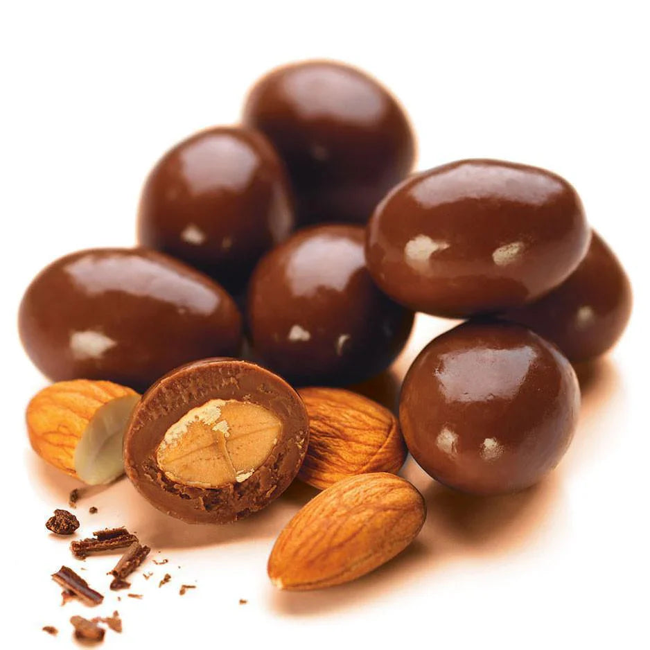 Chocolate-covered peanuts in a clear bowl, sweet Palace chocolates, 1-2 lb bag of crunchy nuts coated in rich chocolate.