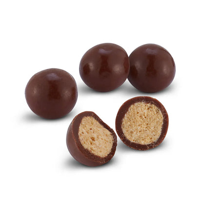 Chocolate-covered peanuts from Sweet Palace, showcasing glossy, crunchy nuts coated in smooth milk chocolate.