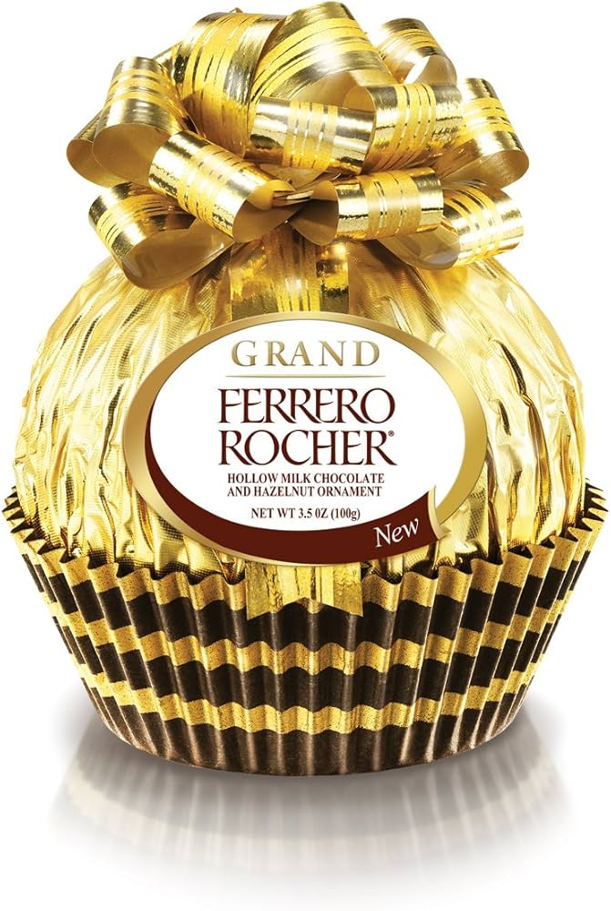 Assorted Ferrero Rocher chocolates from Sweet Palace in a decorative box, featuring the signature gold foil-wrapped hazelnut chocolates.